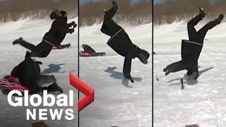 Reporter flipped by sled during news report OFFICIAL VIDEO [upl. by Ugo]