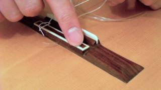 How to Restring a Classical Guitar Tutorial [upl. by Aicilla421]