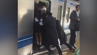 Professional Pushers Shove Passengers Onto Busy Tokyo Train [upl. by Landsman]